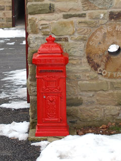 Post box near one of the cottages