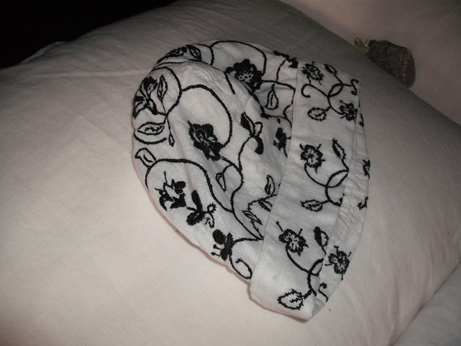 A blackwork coif on the bed