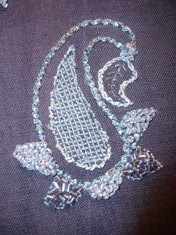 Stitches used - couching, running stitch, chain stitch and lattice