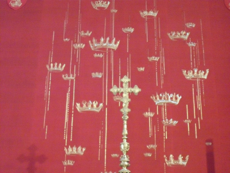 A goldwork hanging of crowns